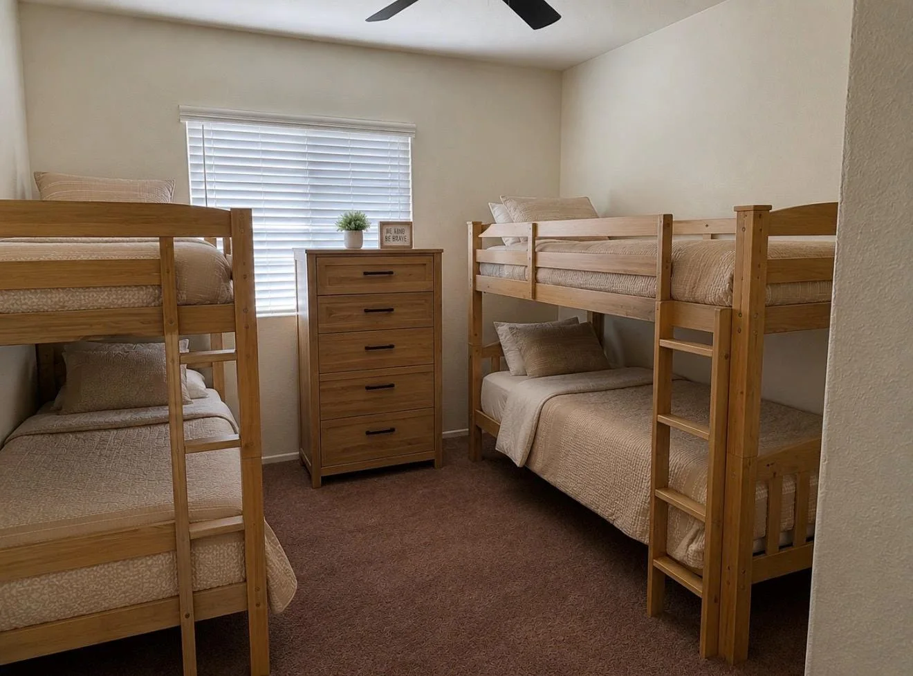 Bright shared bedroom with wooden bunk beds