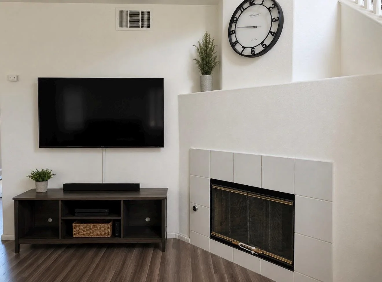 Comfortable living area with television and fireplace
